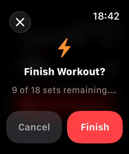 Finish workout confirmation on Apple Watch showing remaining sets with Cancel and Finish buttons